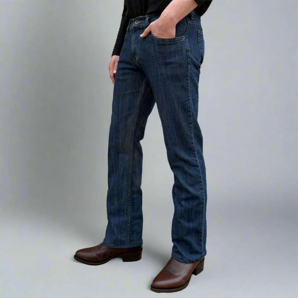 Lower leg of dark wash boot cut jeans showing the wider leg opening made to fit over boots.
