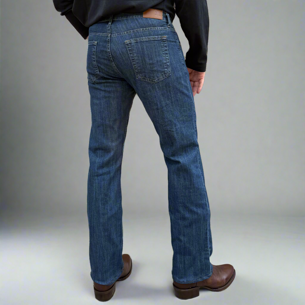 Back view of dark wash boot cut jeans showing back pockets and Horween leather patch at the waistband.