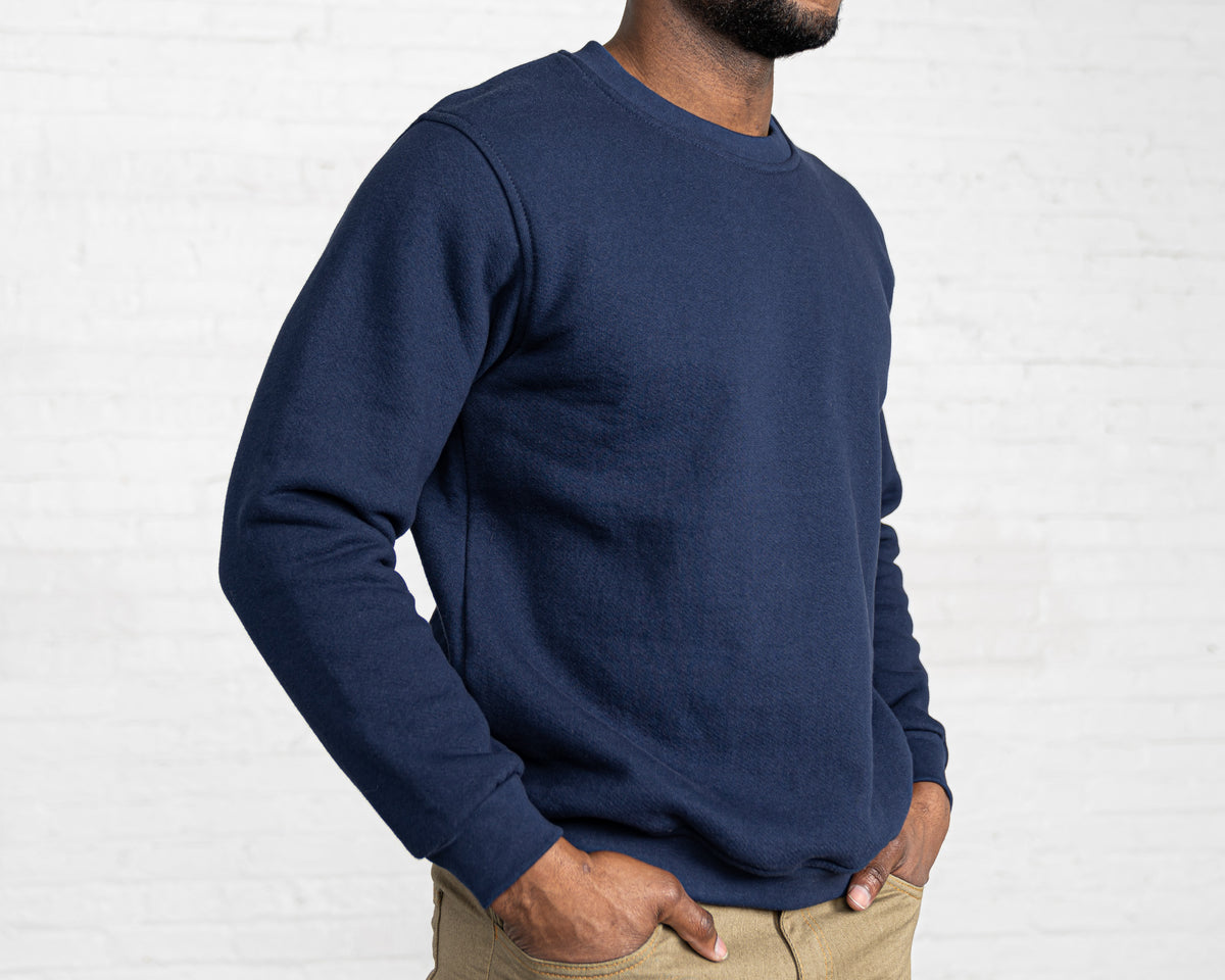 Navy collegiate sweatshirt in heavyweight cotton fleece, shown from the front.