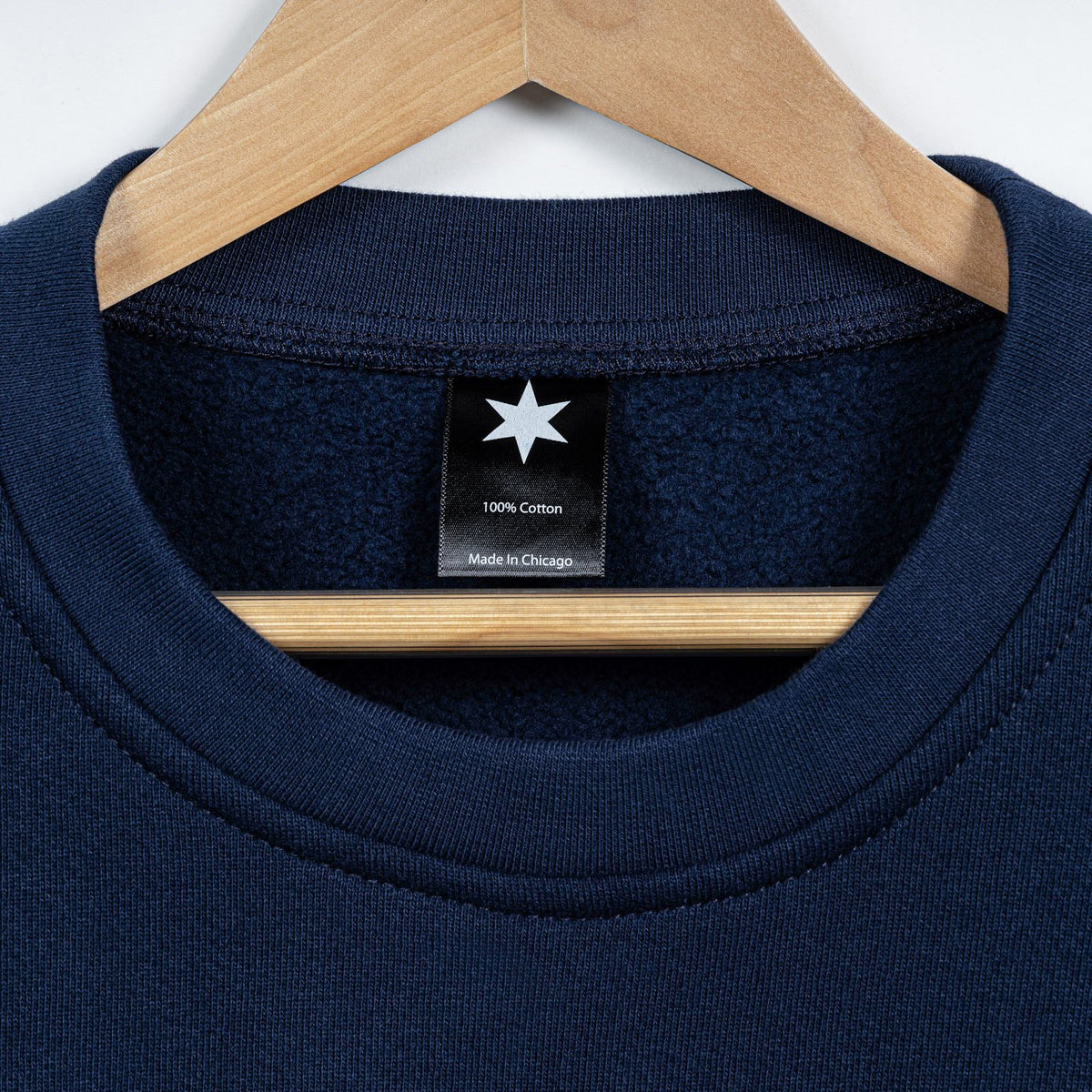 Close-up of the navy three thread fleece knit fabric.
