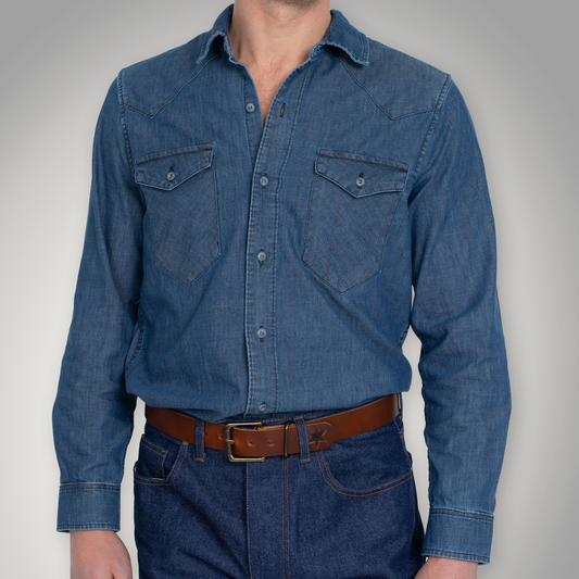 Light wash chambray western shirt, front view, with two chest pockets and button front