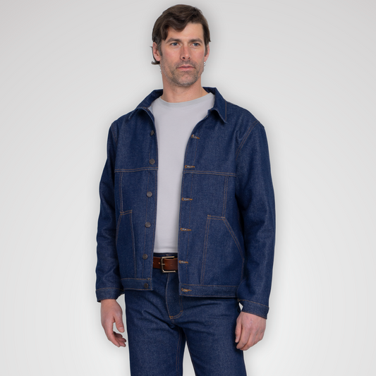 Rigid 14oz denim jacket shown from the front with brass buttons and yellow gold contrast stitching.