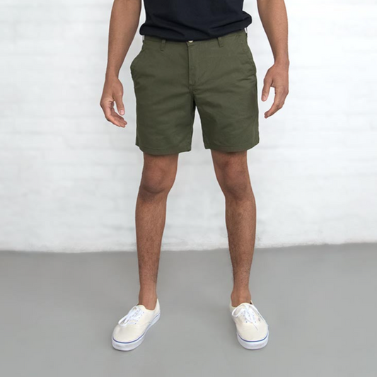 Olive chino shorts laid flat, front view, showing 7 inch length and button closure.