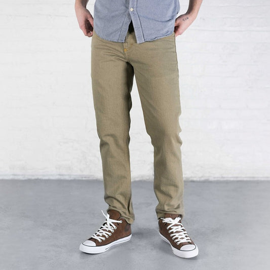 Slim fit khaki stretch jeans shown from the front with tapered leg, leather patch and gold leaf button.