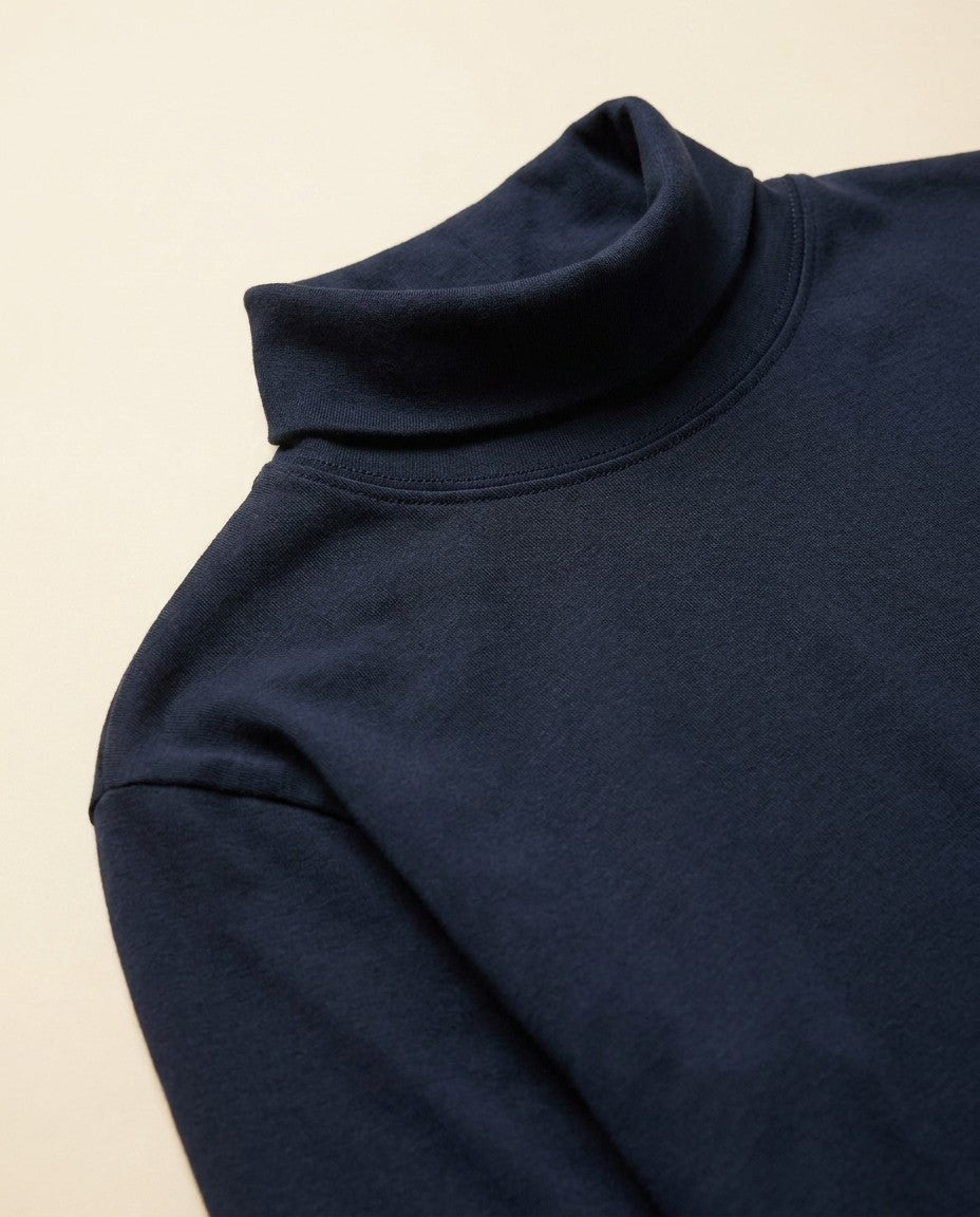 Aspen Turtleneck in Supima cotton interlock knit, front view showing the double turtleneck collar.