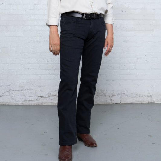 Black boot cut jeans shown front view, laid flat