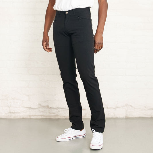 Black Tailored Fit technical pants shown flat, front view