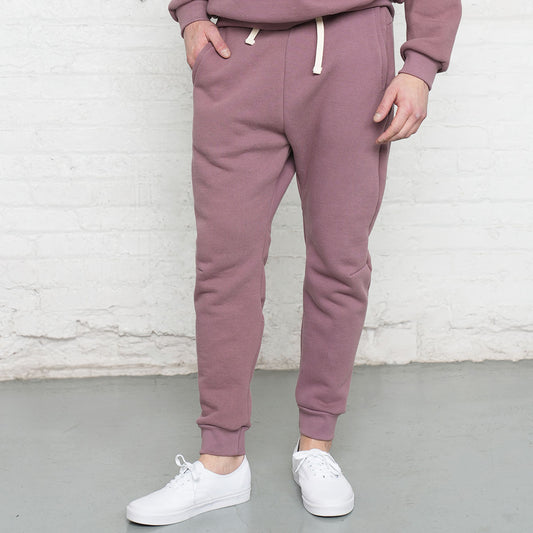 Rose taupe athletic fit sweatpants shown front view with elastic waistband and drawstring.